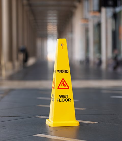 what can a slip and fall lawyer do for you, image of wet floor sign