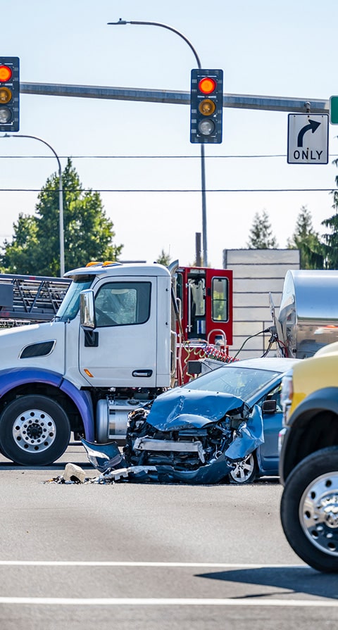 truck accident lawyer, truck accident lawyer in Indiana, Truck wreck and how to get compensation, image of a car totaled by a semi truck on the road